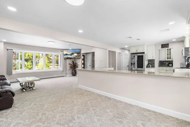 a view of a kitchen with a sink and a window