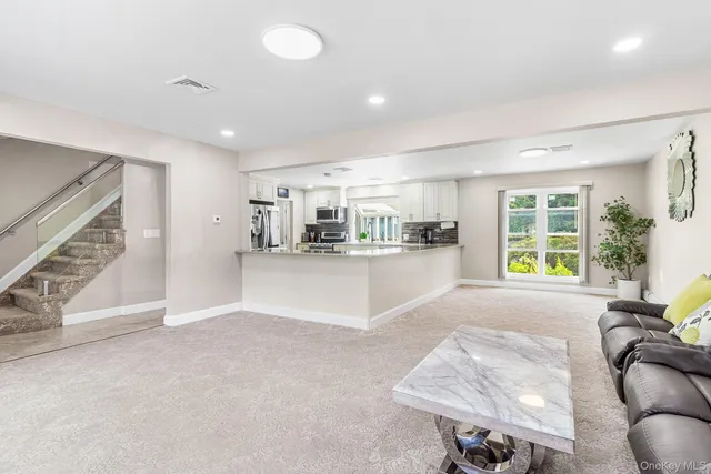 a living room with furniture and a table