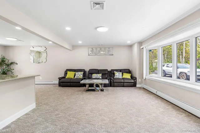 a living room with furniture and a table