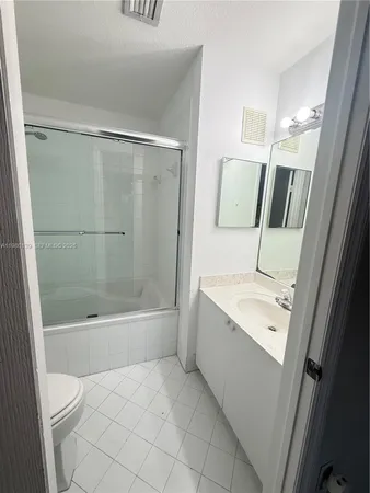 a bathroom with a bathtub sink and toilet