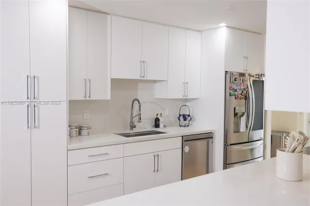 a kitchen with a sink and cabinets