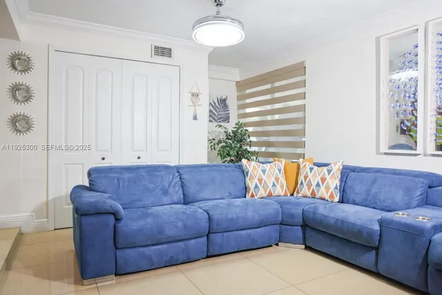 a living room with furniture and a couch