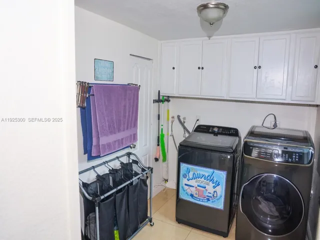 a kitchen with stainless steel appliances granite countertop a stove and a refrigerator