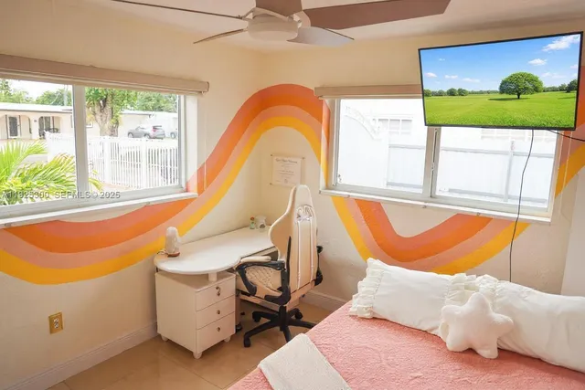 a bed room with a bed and a window