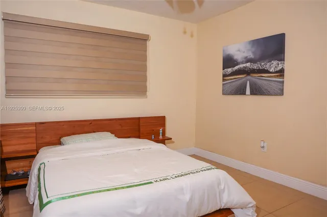 a bathroom with a toilet and a mirror