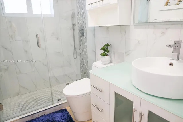 a bathroom with a sink and mirror