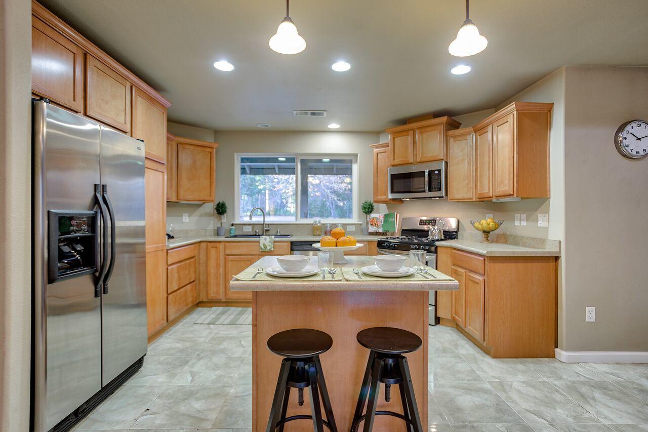 30057 Rl Smith Logging Road Oak Run, CA 96069 - Photo 1 of 58 a kitchen with refrigerator a sink and microwave
