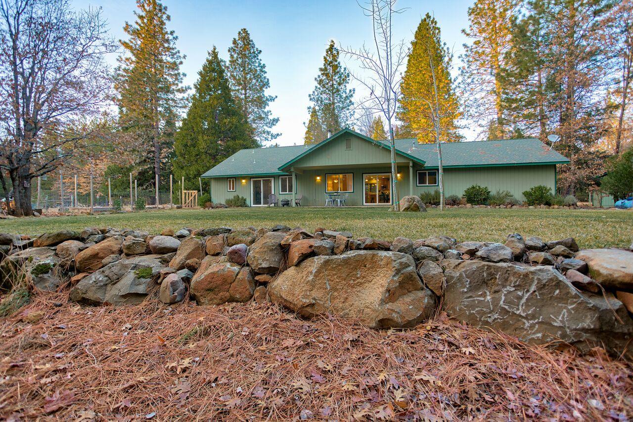 30057 Rl Smith Logging Road Oak Run, CA 96069 - Photo 13 of 58 a front view of a house with a yard and trees