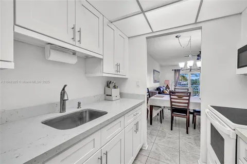 a kitchen with a sink cabinets and counter space