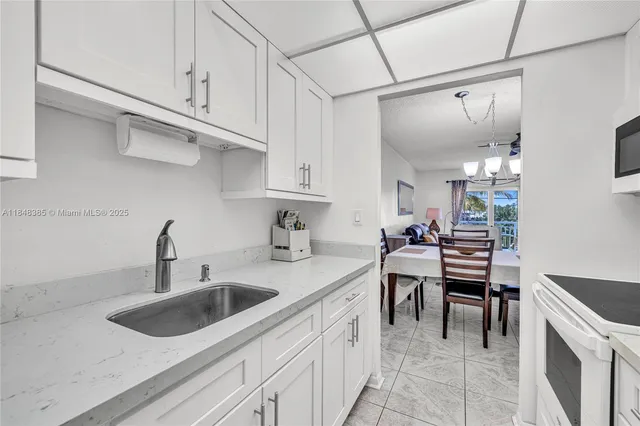 a kitchen with a sink cabinets and counter space