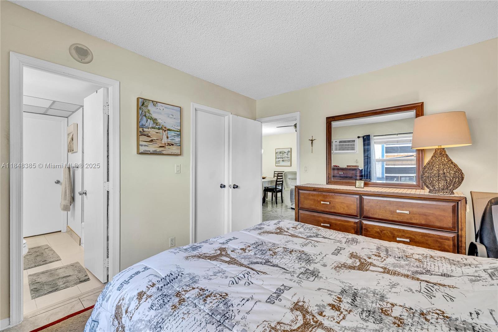 200 South Birch Road, Unit 201 Fort Lauderdale, FL 33316 - Photo 19 of 28 a bedroom with a bed and a dresser