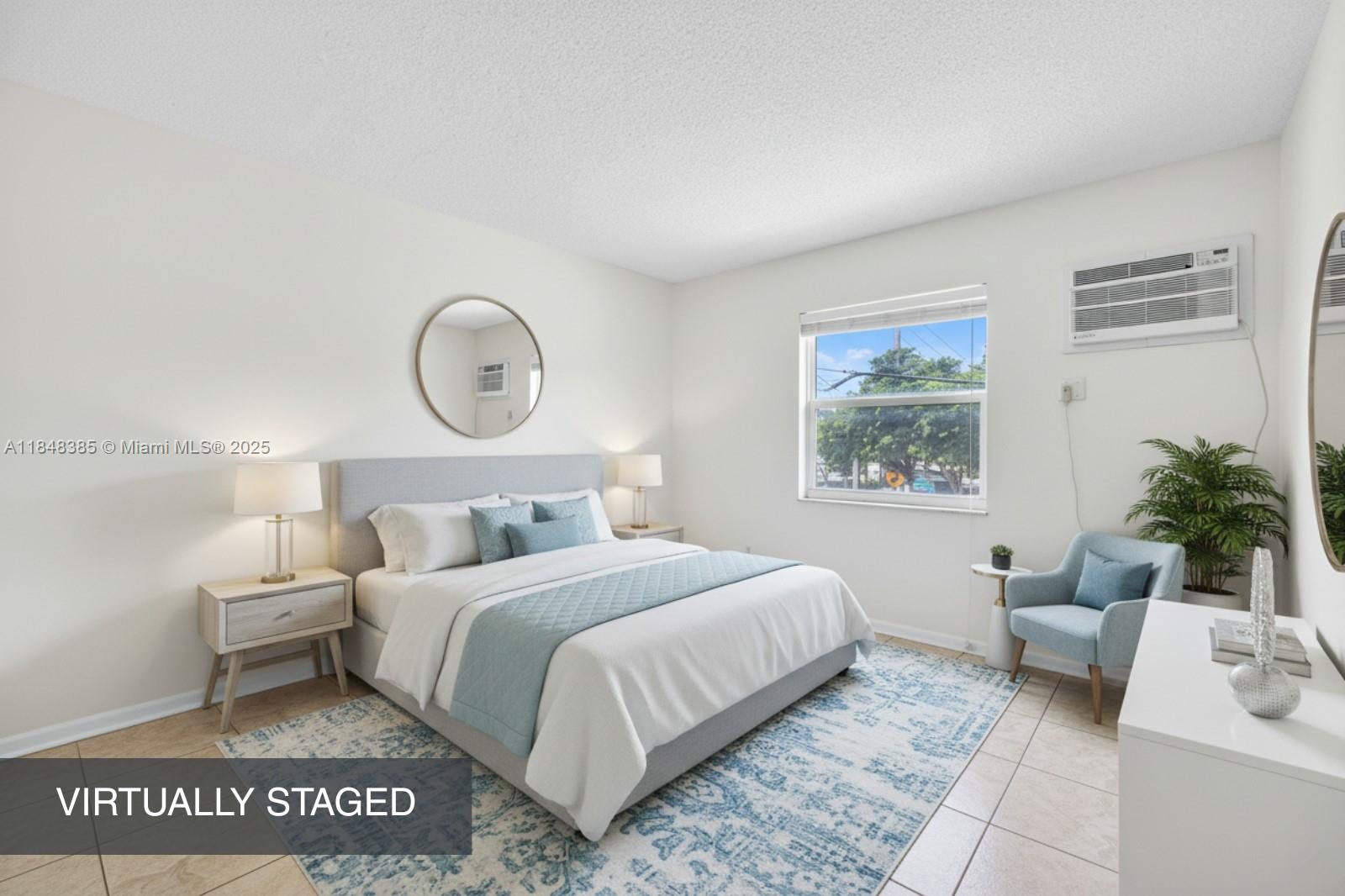 200 South Birch Road, Unit 201 Fort Lauderdale, FL 33316 - Photo 4 of 28 a bedroom with a large bed and a window