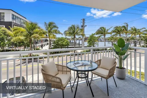 a view of a chairs and table in patio