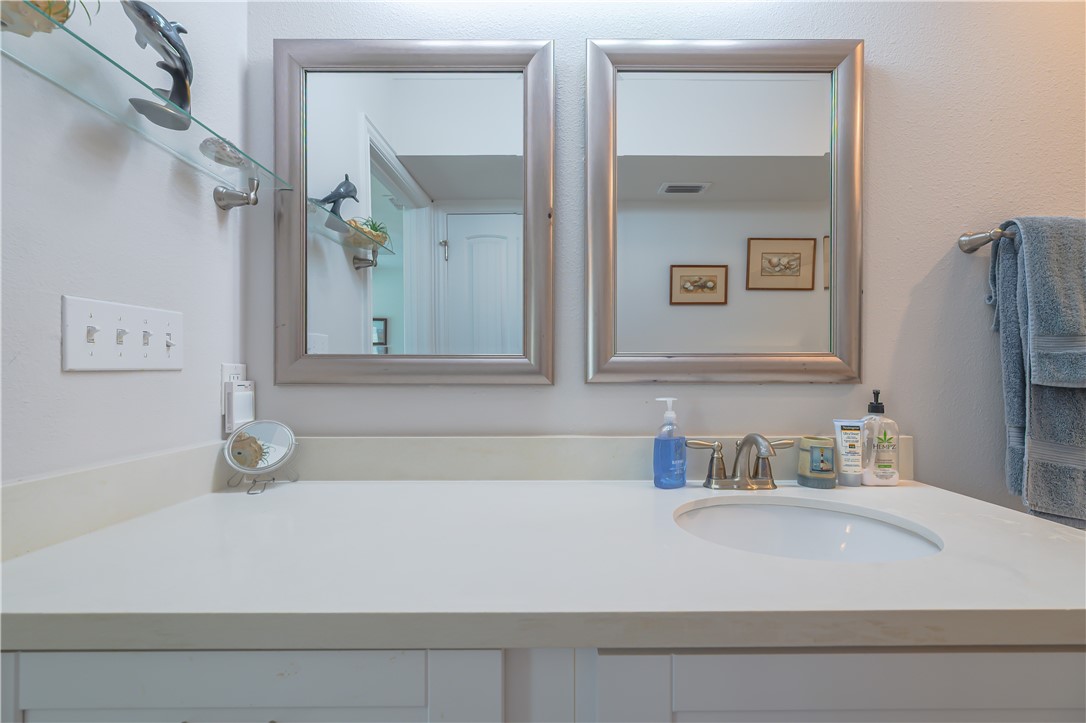 620 Fulton Beach Road, Unit 708 Rockport, TX 78382 - Photo 22 of 38 a bathroom with a bathtub sink and vanity