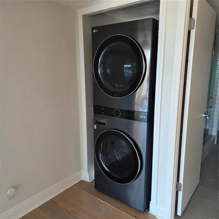 a living room with furniture a flat screen tv and a window