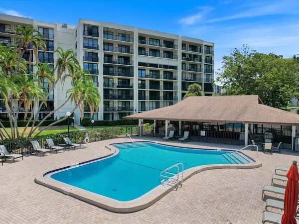 swimming pool view with a seating space