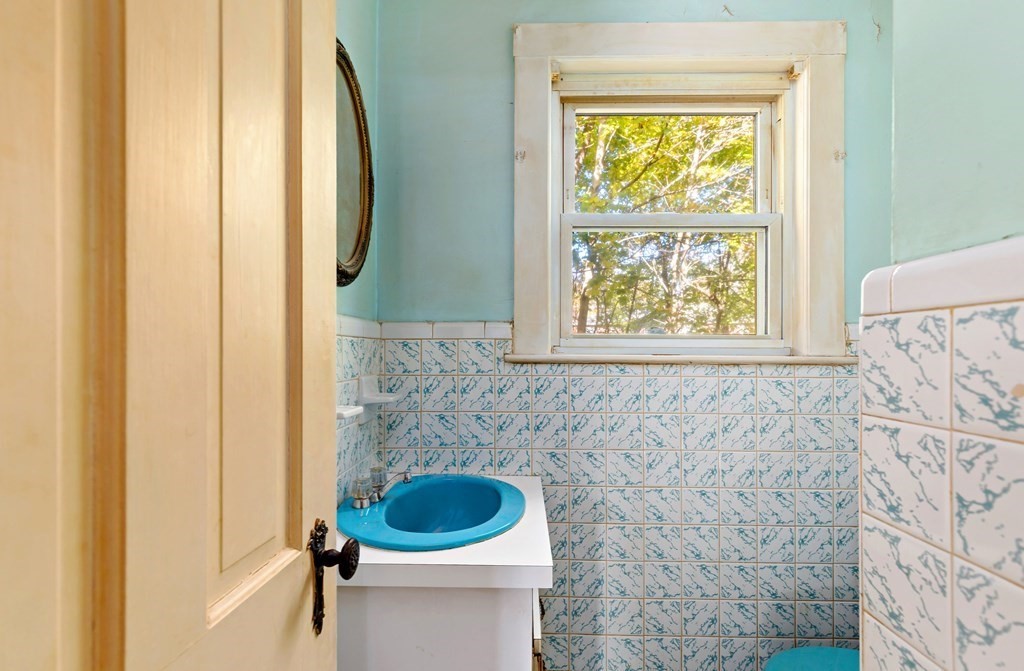 45 Chesterfield Road Milton, MA 02186 - Photo 11 of 23 a bathroom with a toilet and a sink