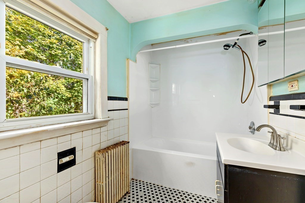 45 Chesterfield Road Milton, MA 02186 - Photo 18 of 23 a bathroom with a sink a bathtub and a shower