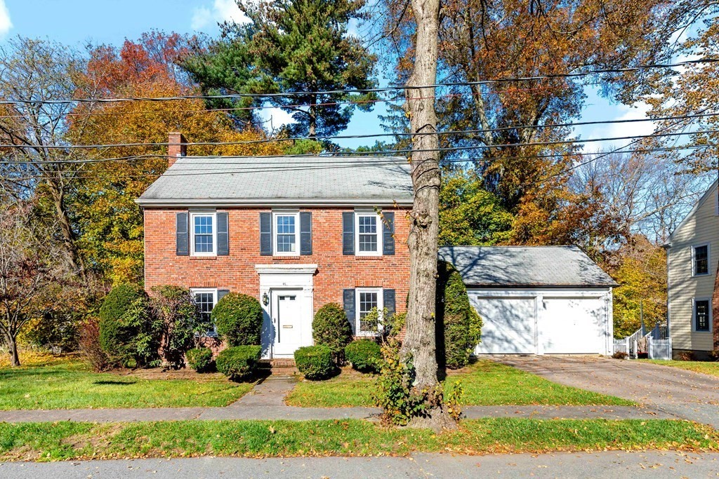45 Chesterfield Road Milton, MA 02186 - Photo 2 of 23 a front view of a house with a yard and a garage