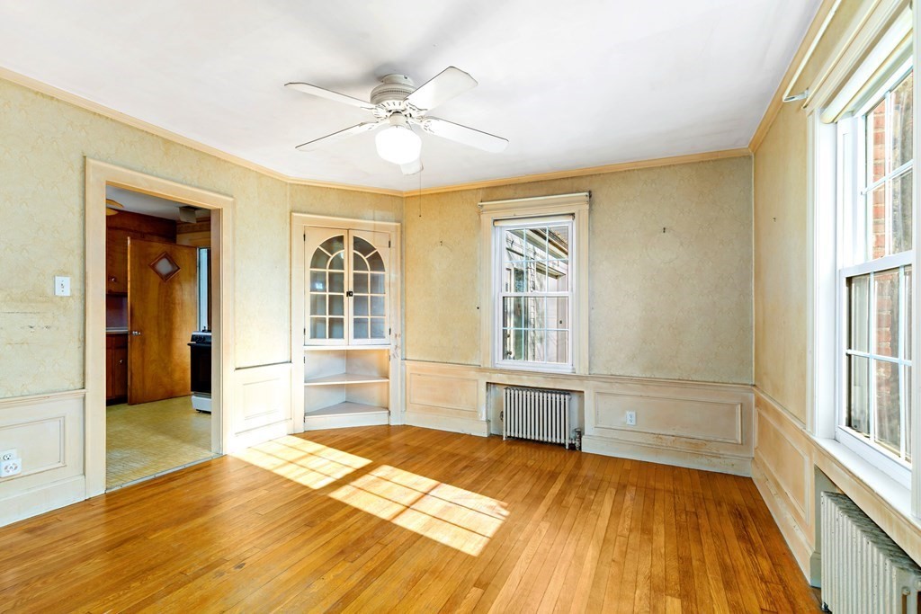 45 Chesterfield Road Milton, MA 02186 - Photo 4 of 23 a view of a bedroom with wooden floor and windows