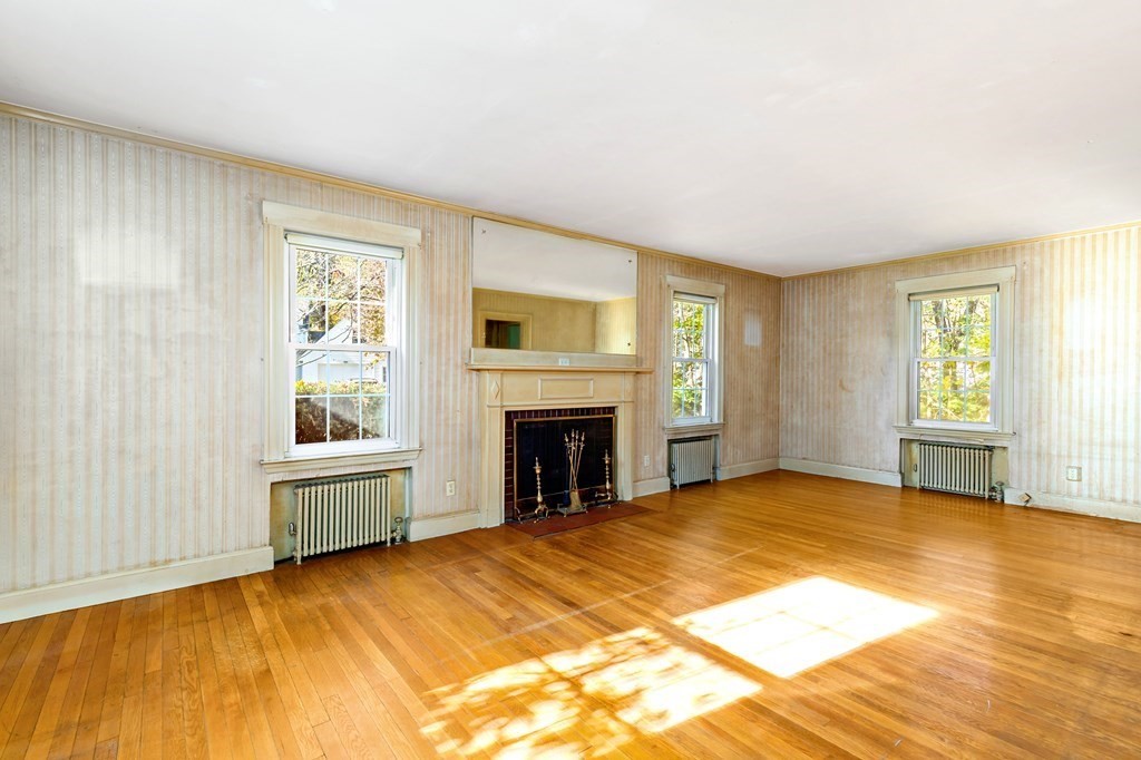 45 Chesterfield Road Milton, MA 02186 - Photo 5 of 23 a view of an empty room with window and fire place