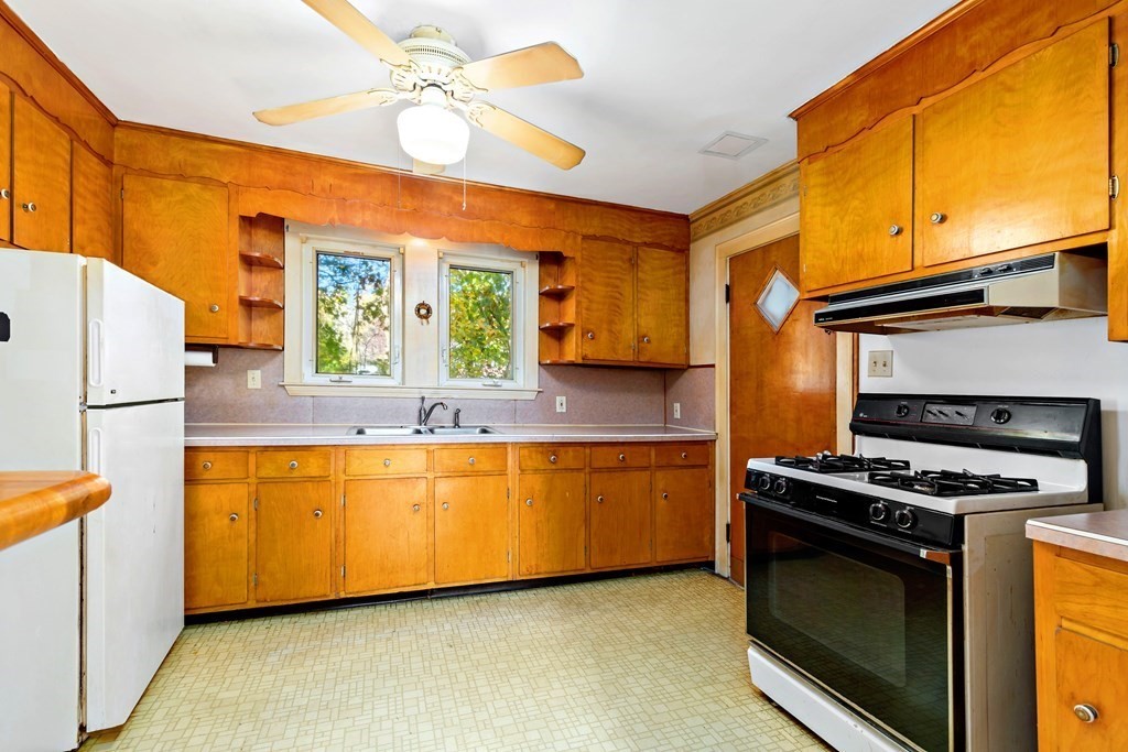 45 Chesterfield Road Milton, MA 02186 - Photo 7 of 23 a kitchen with stainless steel appliances granite countertop a stove and a refrigerator