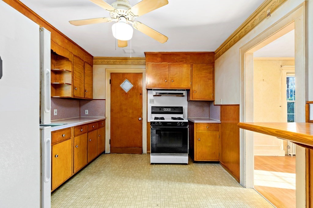 45 Chesterfield Road Milton, MA 02186 - Photo 8 of 23 a kitchen with stainless steel appliances granite countertop a stove and a refrigerator