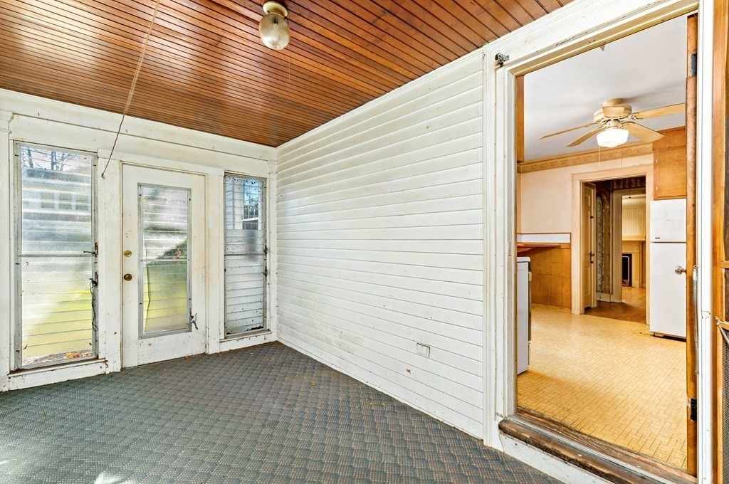45 Chesterfield Road Milton, MA 02186 - Photo 10 of 23 a view of a hallway with wooden floor and a bathroom