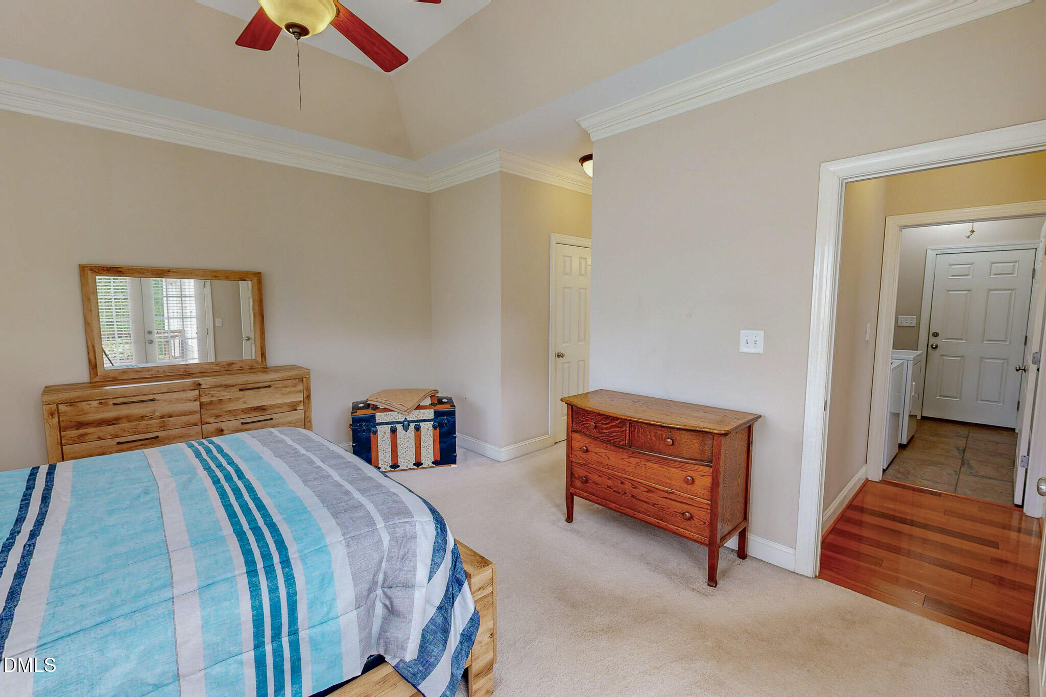 115 Duncan Plantation Road Timberlake, NC 27583 - Photo 11 of 48 a bedroom with two beds and a chandelier