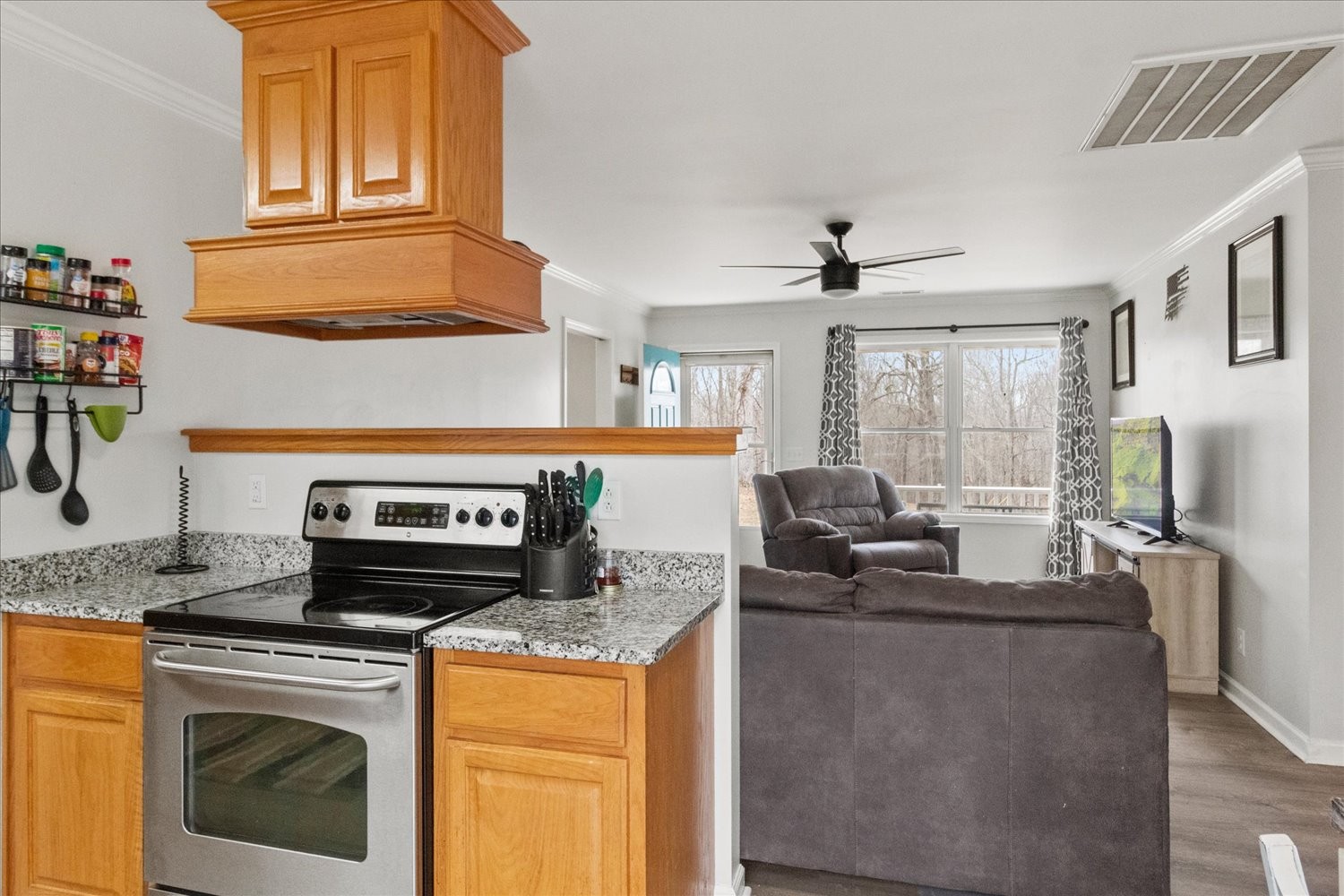 351 Rippy Ridge Road Normandy, TN 37360 - Photo 11 of 45 a kitchen with stainless steel appliances granite countertop a stove a sink and a microwave