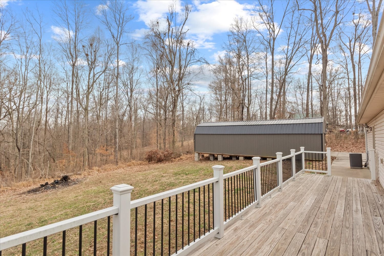 351 Rippy Ridge Road Normandy, TN 37360 - Photo 32 of 45 a view of a deck with wooden floor and fence