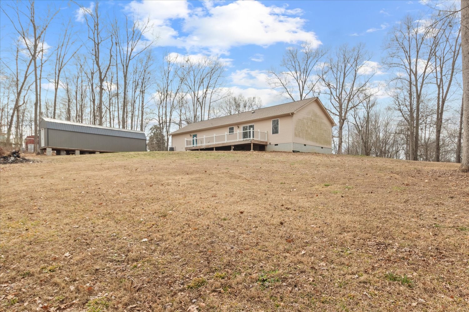 351 Rippy Ridge Road Normandy, TN 37360 - Photo 35 of 45 a backyard of a house with large trees