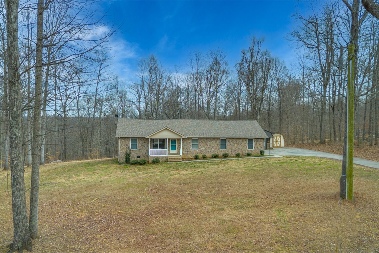 351 Rippy Ridge Road Normandy, TN 37360 - Photo 38 of 45 a house with trees in the background