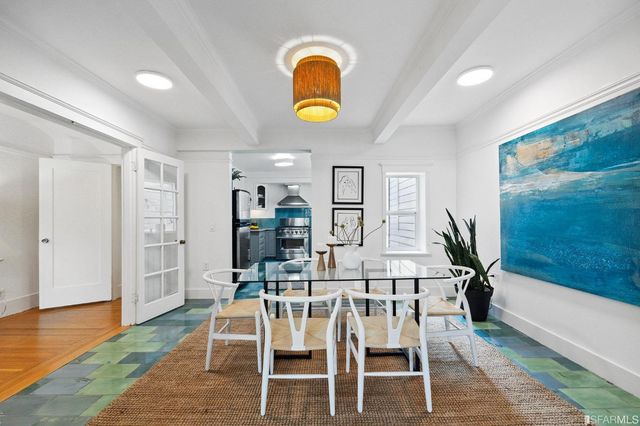 a view of a dining room with furniture wooden floor and window