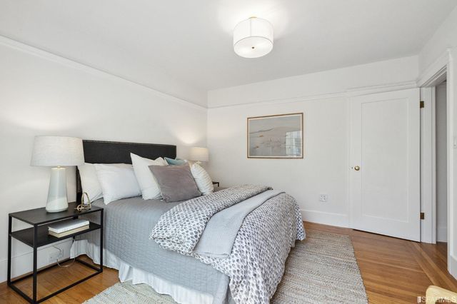 a bed room with a bed and a lamp