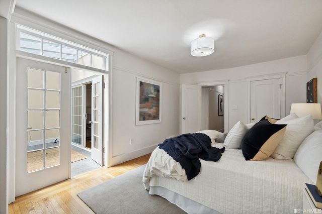 a living room with a bed and a window