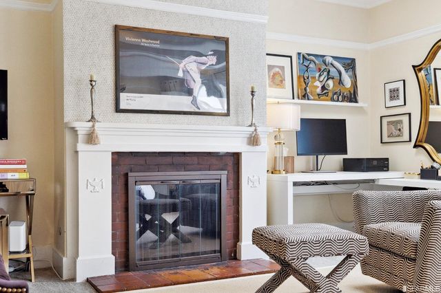 a living room with furniture fireplace and flat screen tv