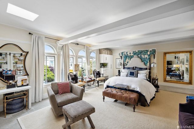 a view of a hallway with wooden floor and cabinet