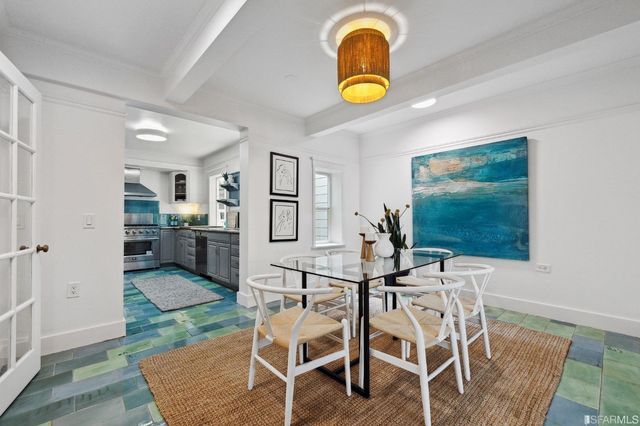 a view of a dining room with furniture and a table