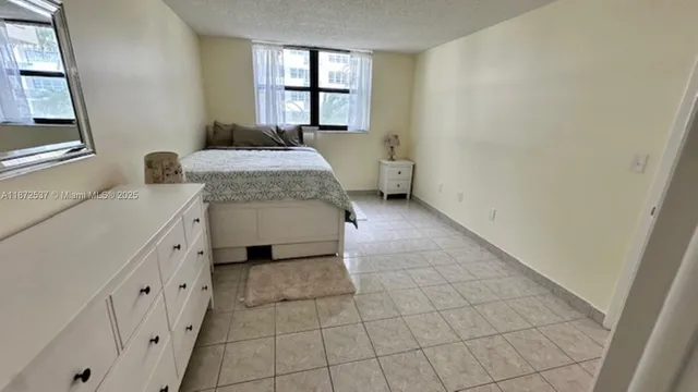 a bathroom with a sink toilet and window
