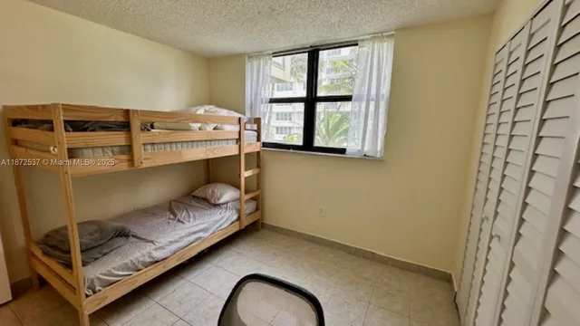 a bed room with a bed and window