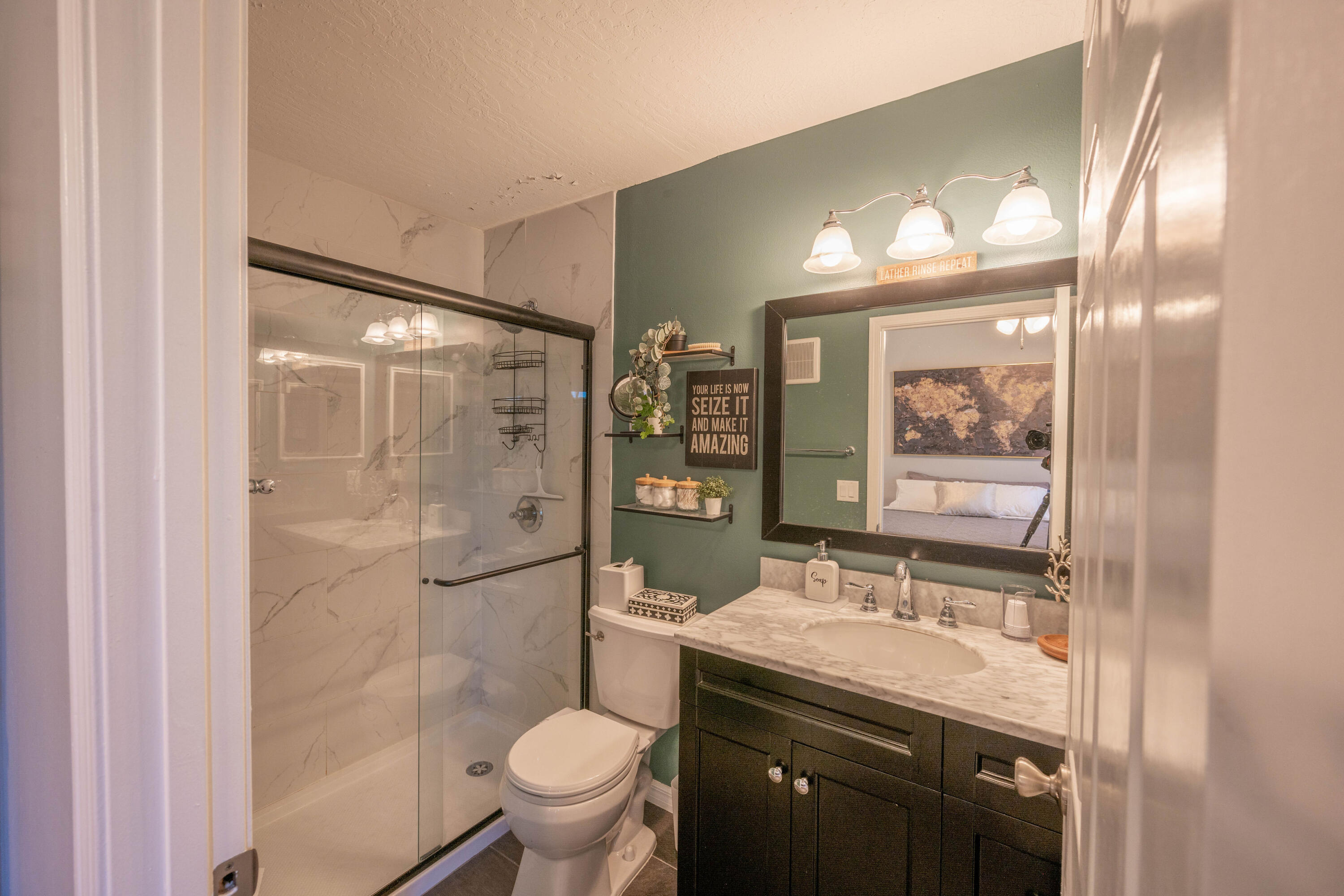 7667 North Wickham Road, Unit 1518 Melbourne, FL 32940 - Photo 14 of 32 a bathroom with a granite countertop sink toilet and shower