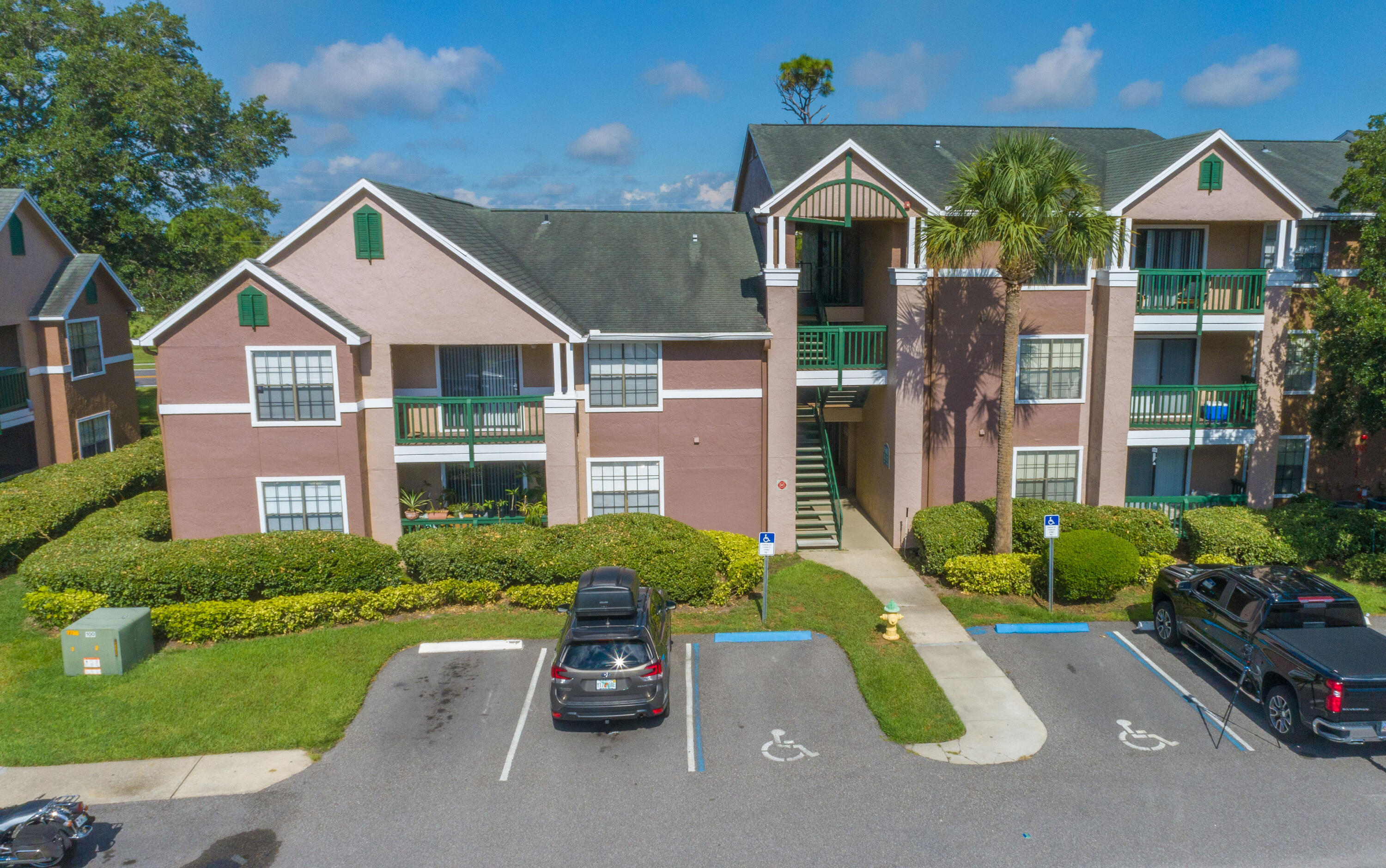 7667 North Wickham Road, Unit 1518 Melbourne, FL 32940 - Photo 18 of 32 a front view of a house with garden