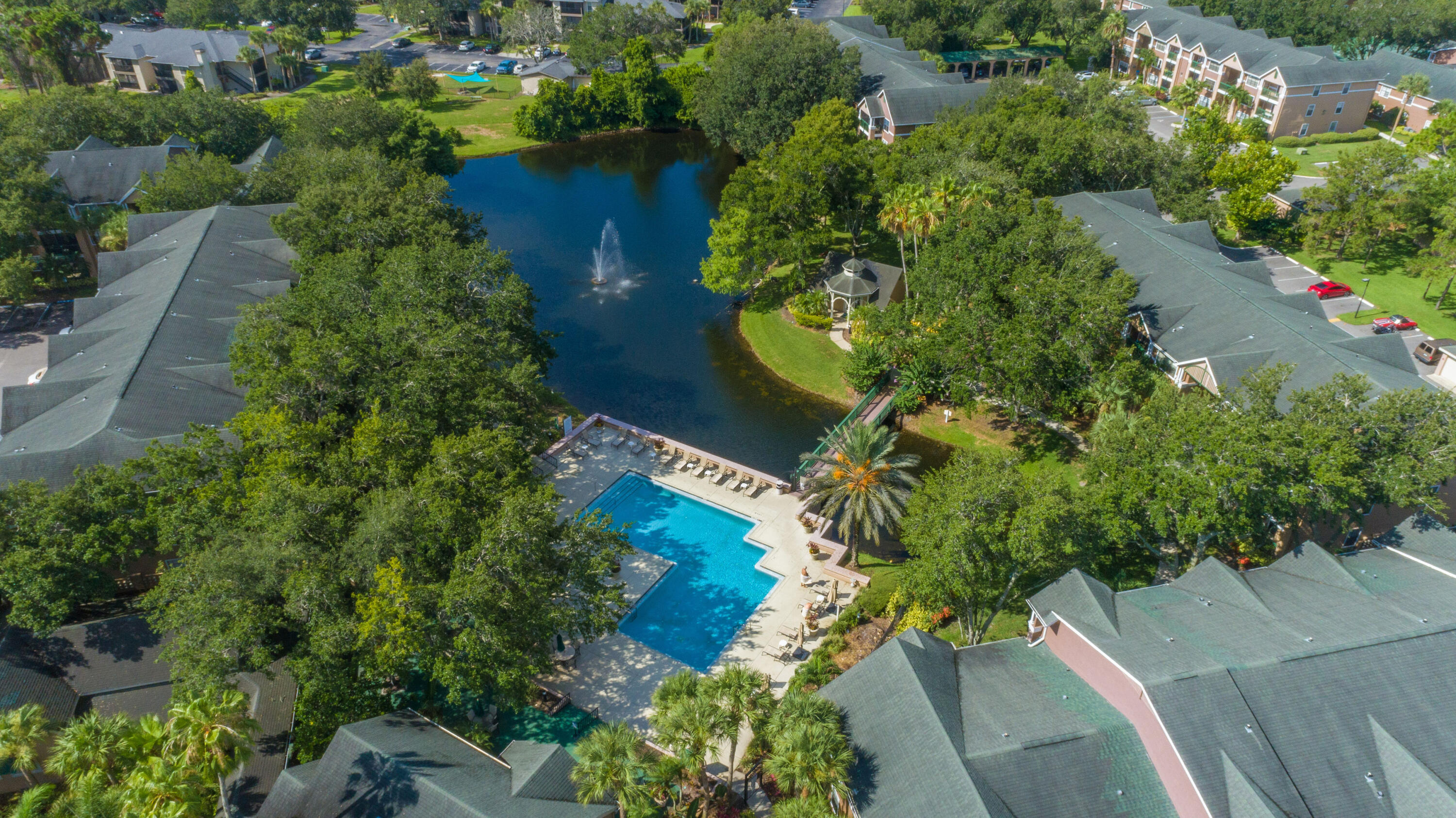 7667 North Wickham Road, Unit 1518 Melbourne, FL 32940 - Photo 23 of 32 an aerial view of a house with a yard