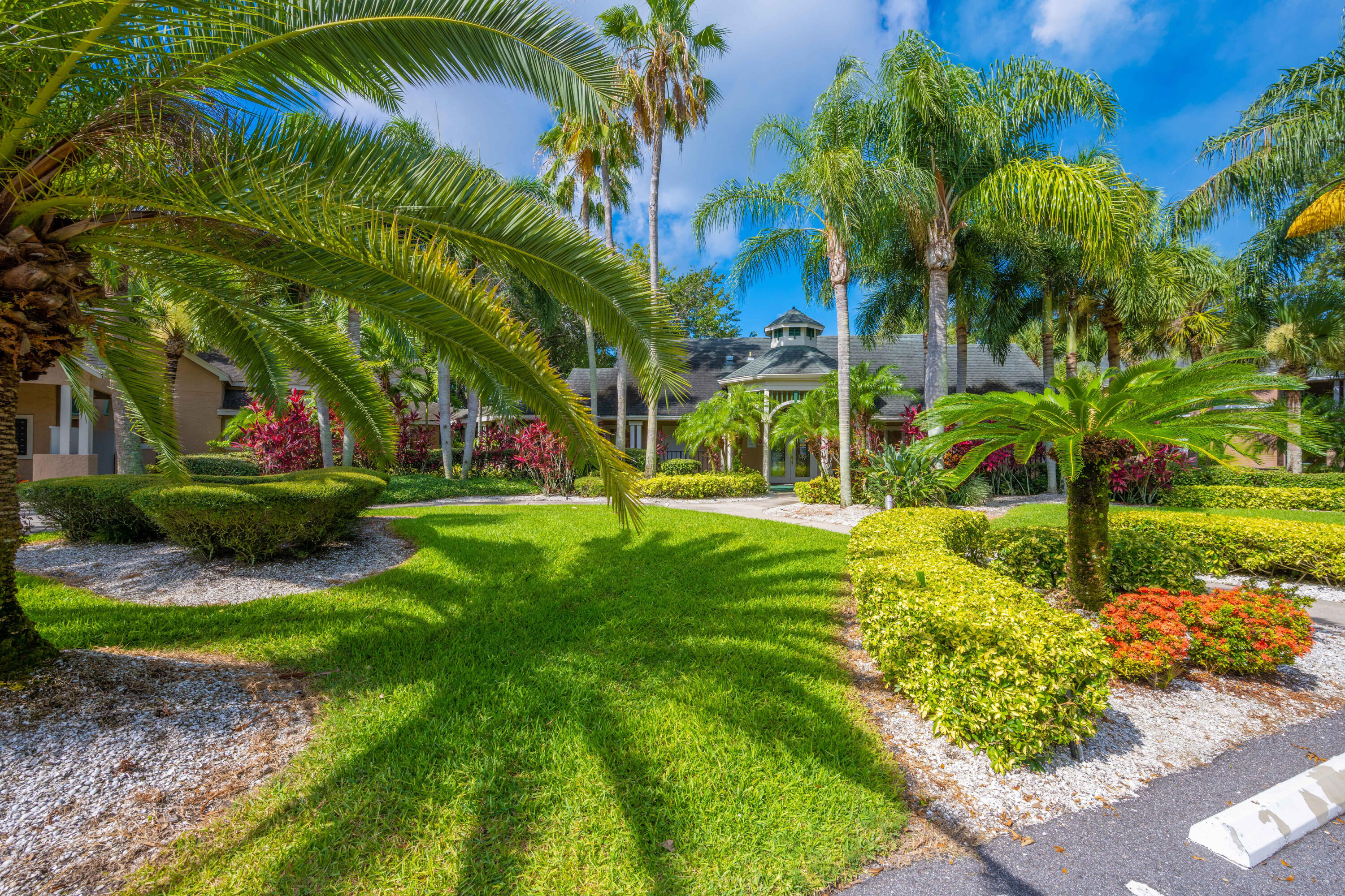 7667 North Wickham Road, Unit 1518 Melbourne, FL 32940 - Photo 29 of 32 a view of a garden with a tree