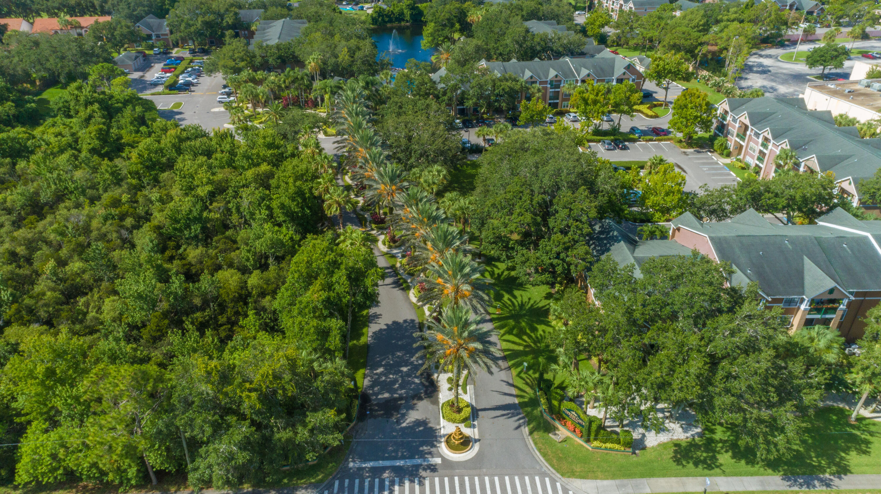 7667 North Wickham Road, Unit 1518 Melbourne, FL 32940 - Photo 30 of 32 an aerial view of residential house with outdoor space and trees all around