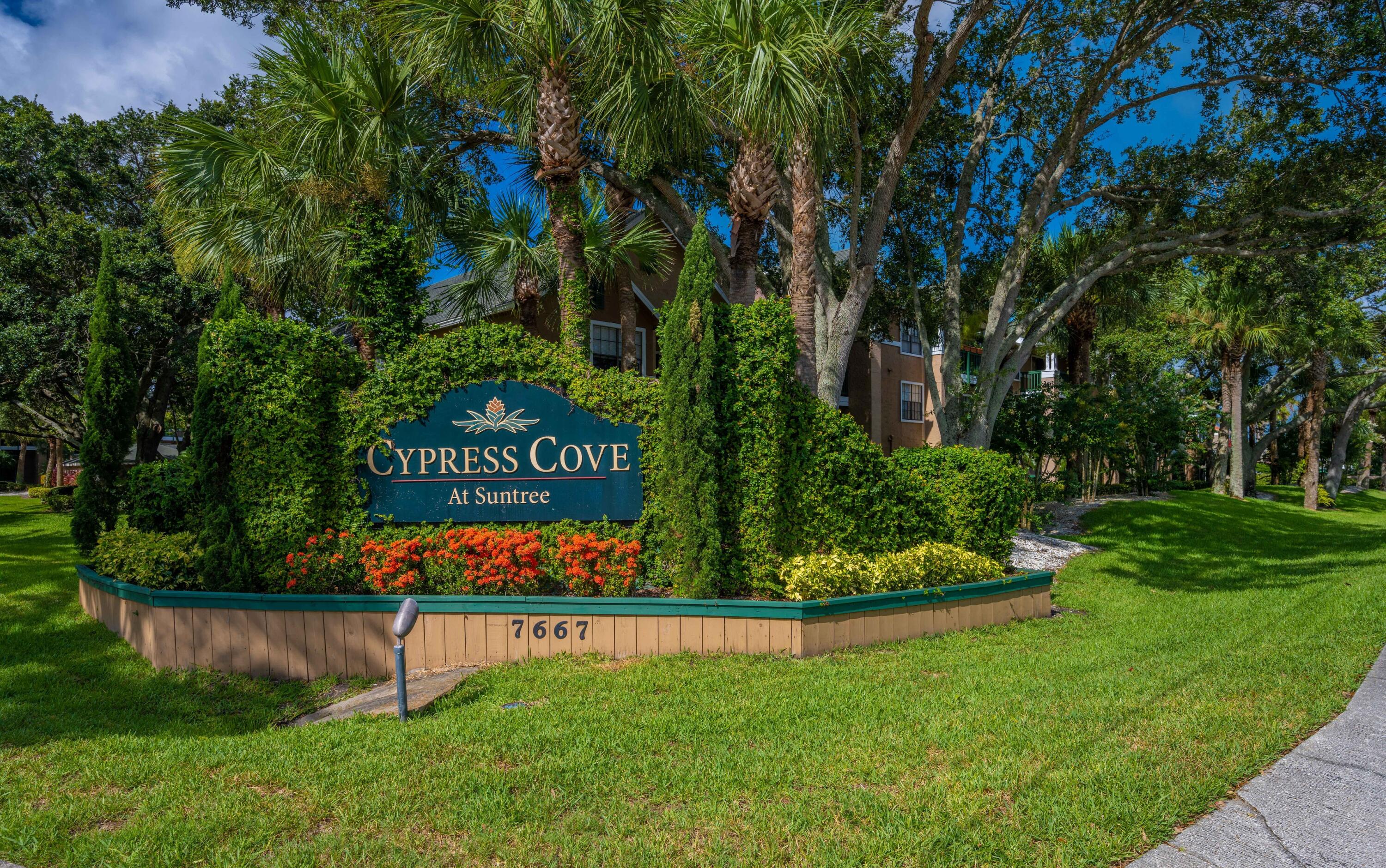 7667 North Wickham Road, Unit 1518 Melbourne, FL 32940 - Photo 32 of 32 a view of a sign board with garden
