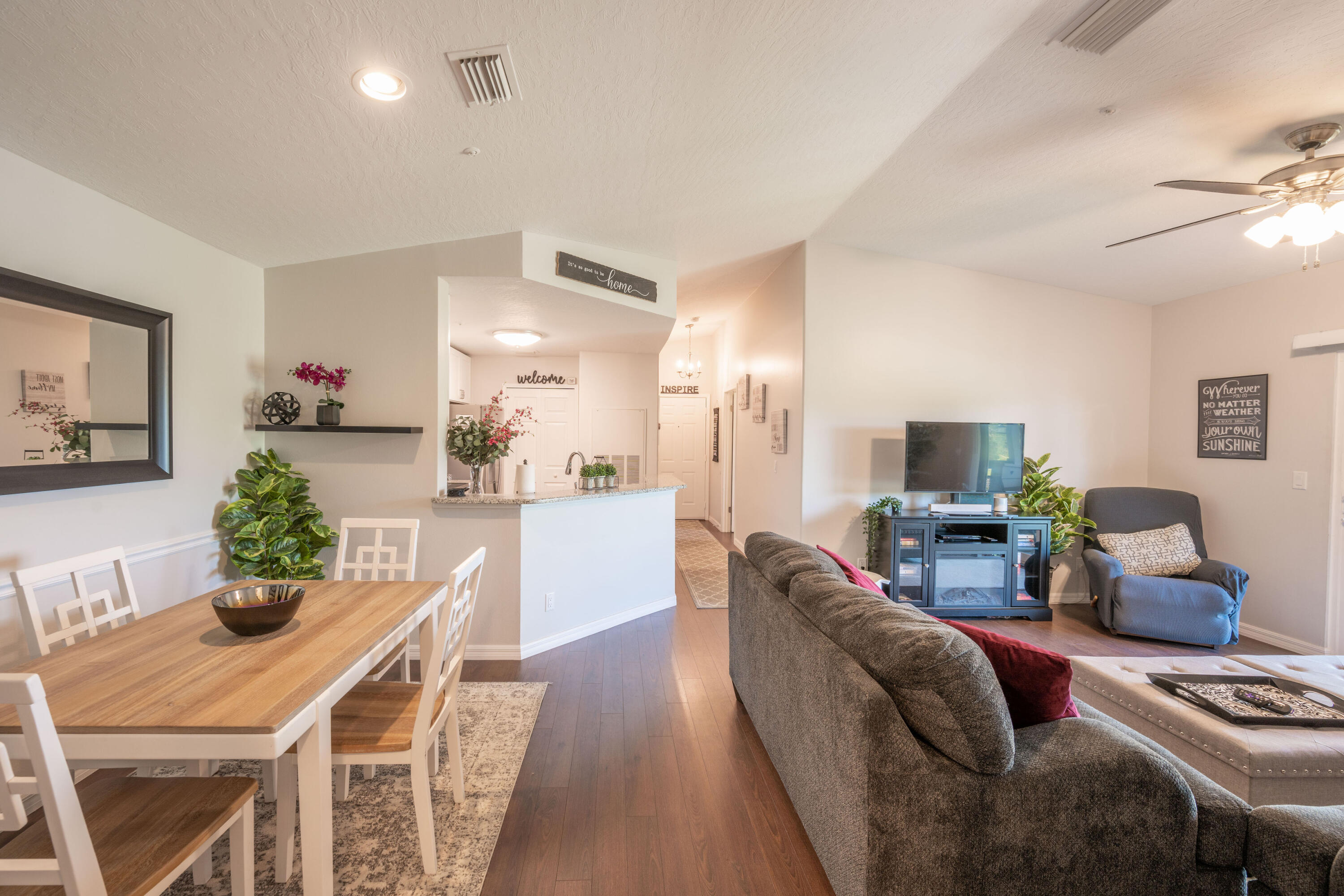 7667 North Wickham Road, Unit 1518 Melbourne, FL 32940 - Photo 5 of 32 a living room with furniture and a wooden floor