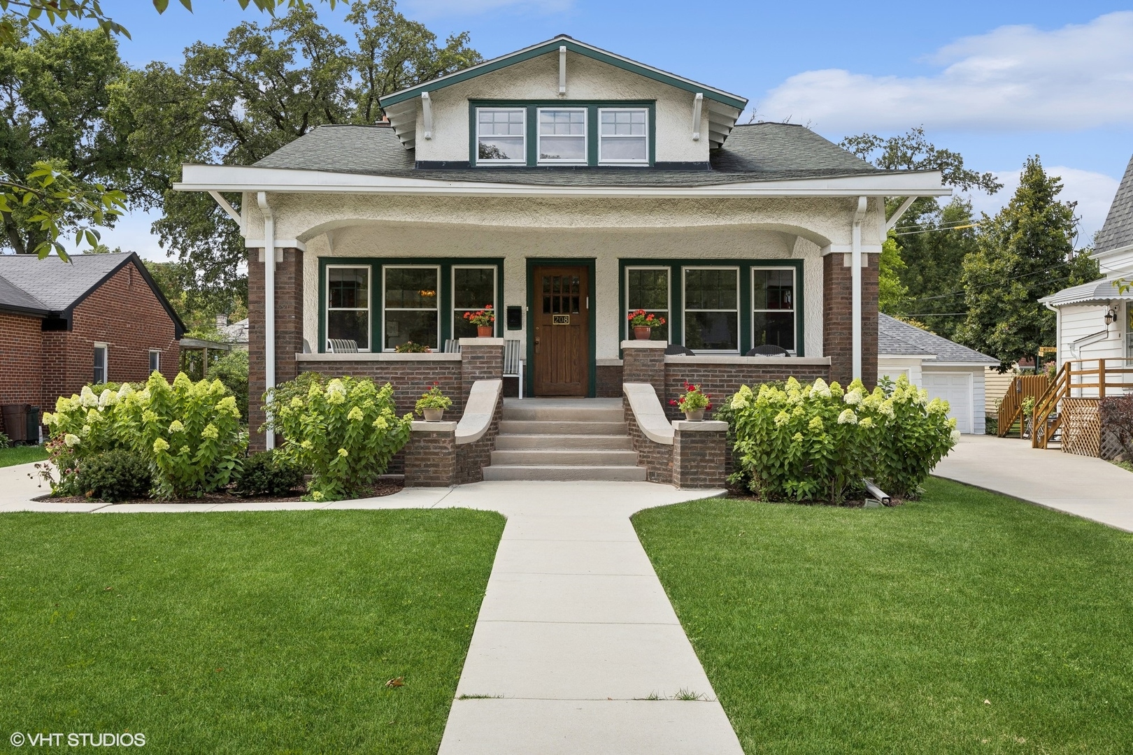 208 Woodside Road Riverside, IL 60546 - Photo 1 of 37 a front view of a house with a yard