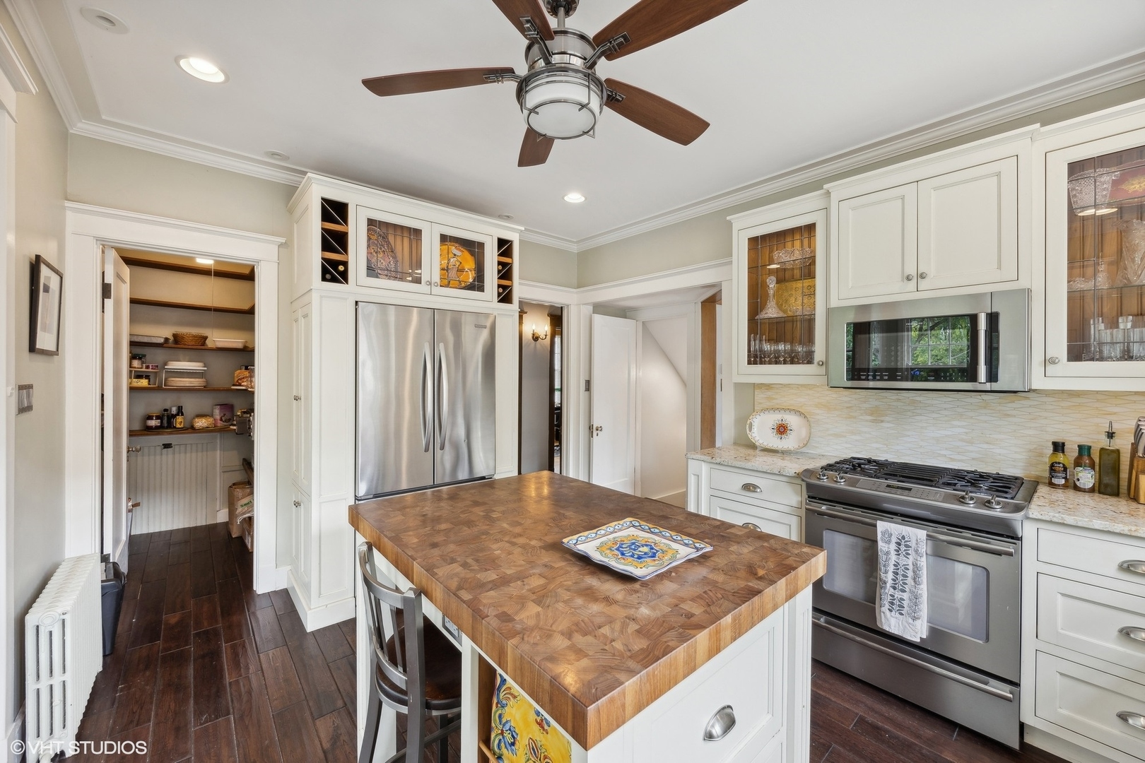 208 Woodside Road Riverside, IL 60546 - Photo 18 of 37 a kitchen with stainless steel appliances granite countertop a stove and a refrigerator